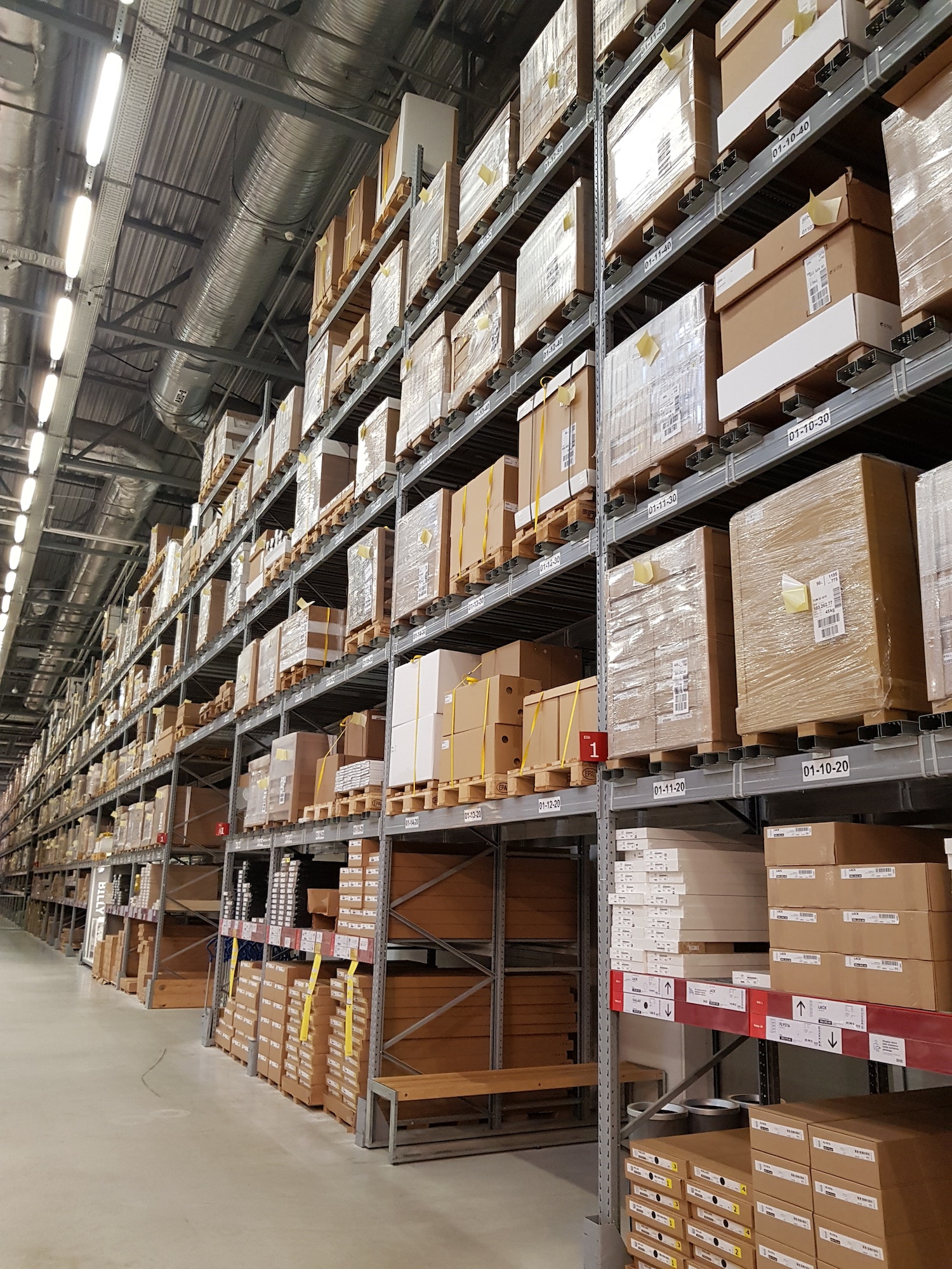 Racks with boxes in a hypermarket warehouse -